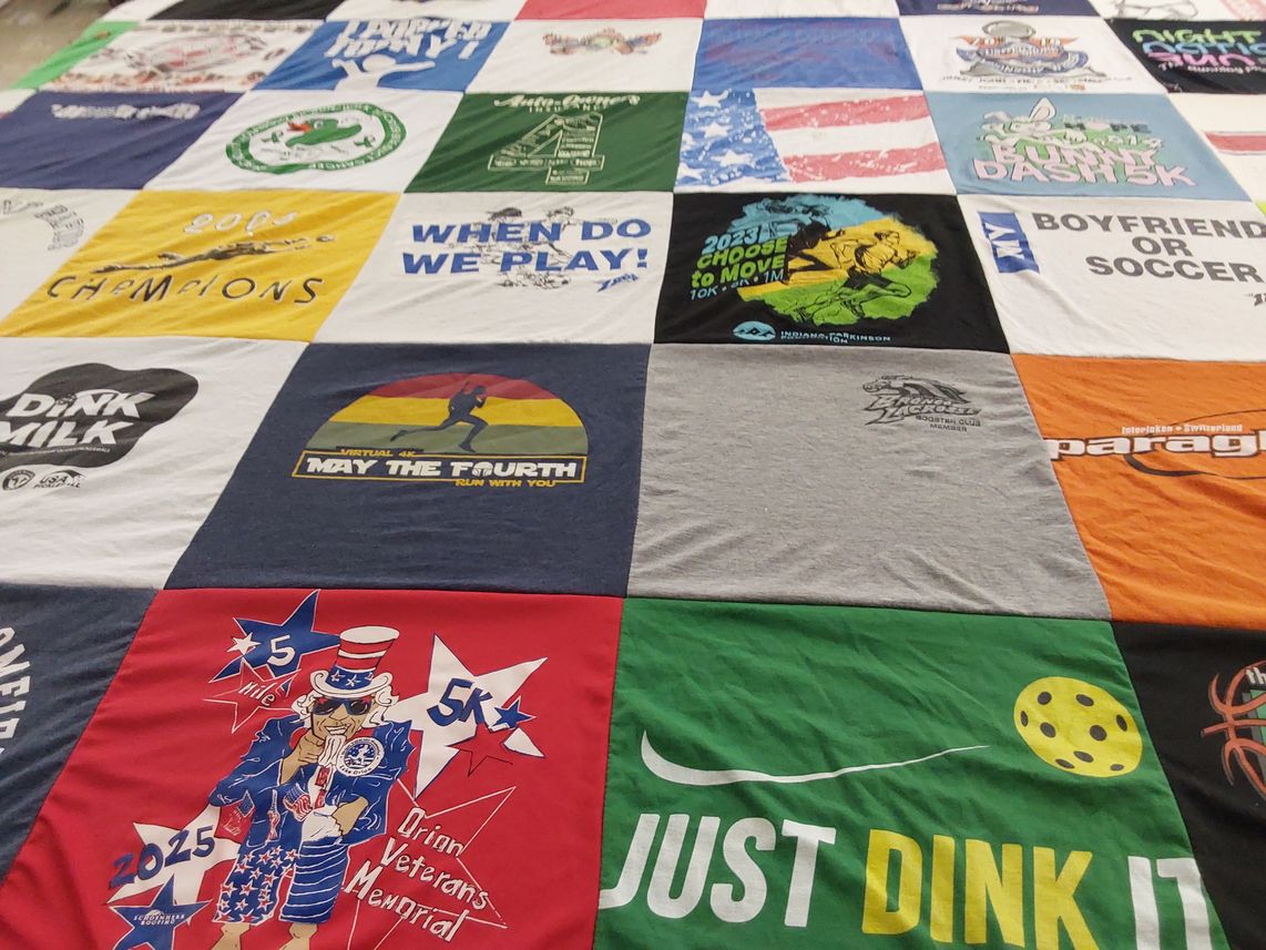 T-shirt quilt with running, soccer themes by Sara from MI