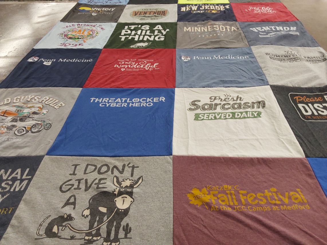 T-shirt quilt with local events, humor themes by Nina from NJ