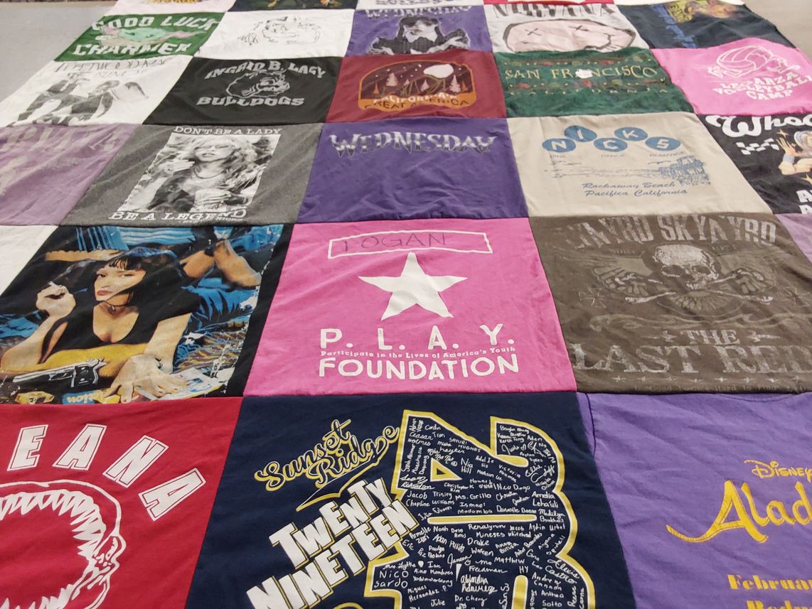 T-shirt quilt with music, pop culture themes by Robin from CA