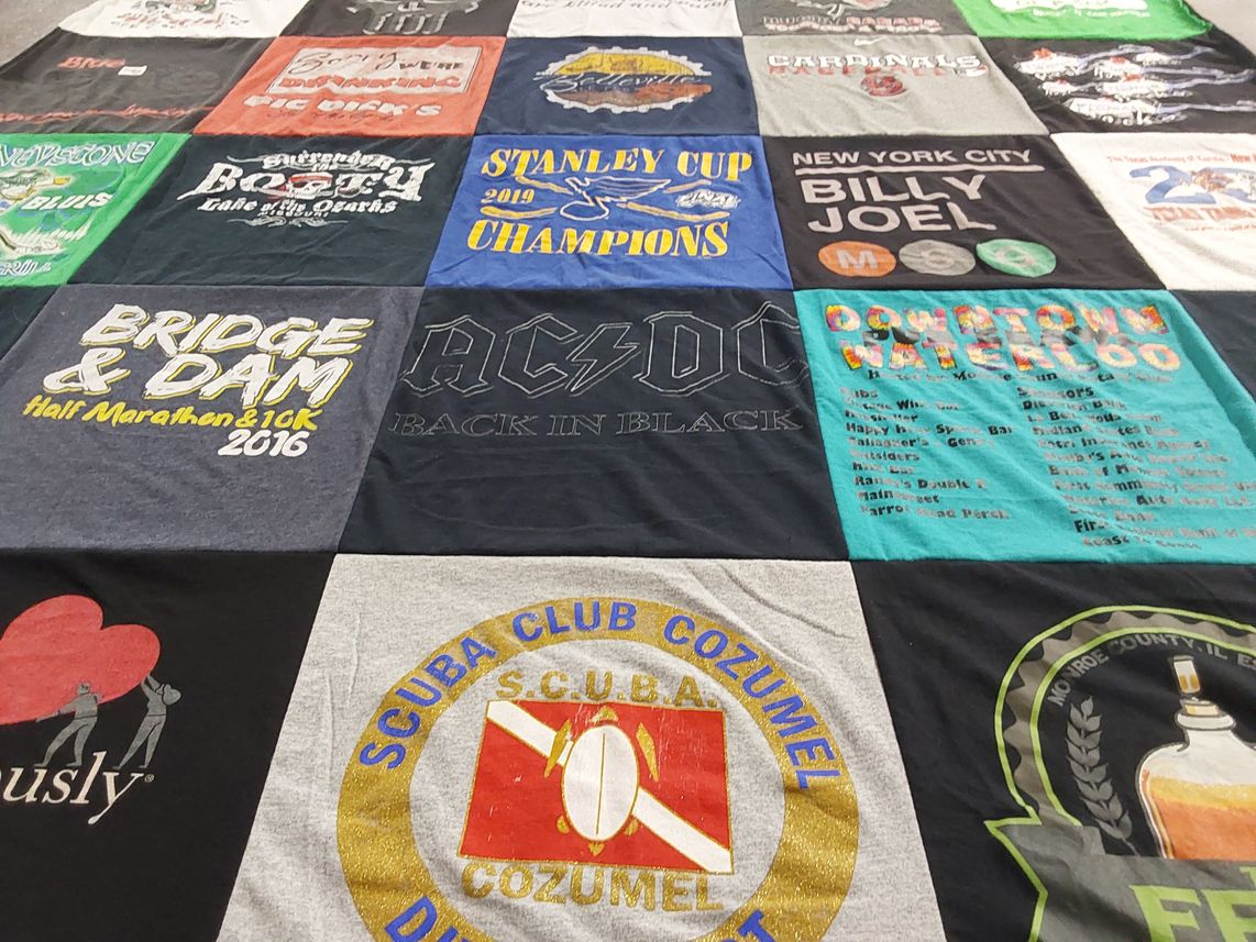 T-shirt quilt with music, running themes by Anne from IL