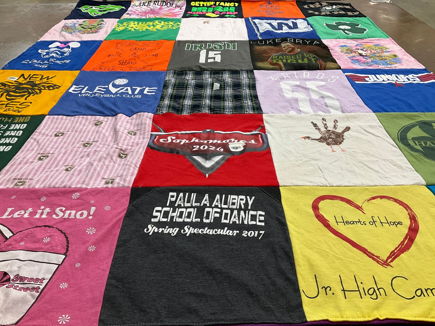 T-shirt quilt with volleyball, dance themes by Elizabeth from IL