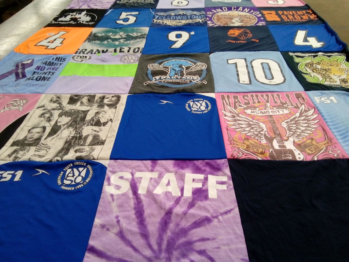 T-shirt quilt with music, soccer themes by Carrie from OR