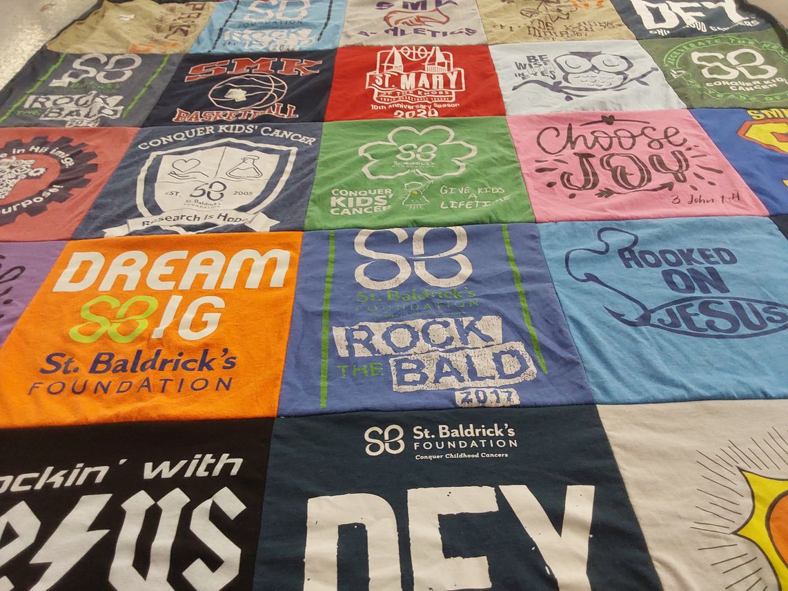 T-shirt quilt with cancer research, childhood cancer themes by Stacy from IN