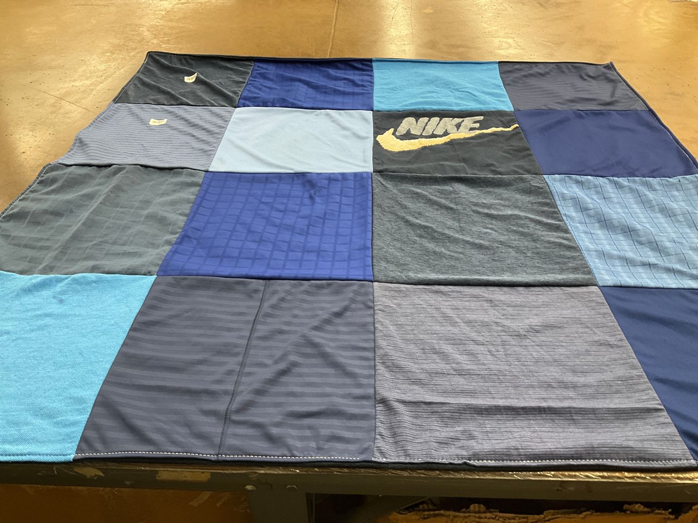 T-shirt quilt with sports, fashion themes by Billie from CA
