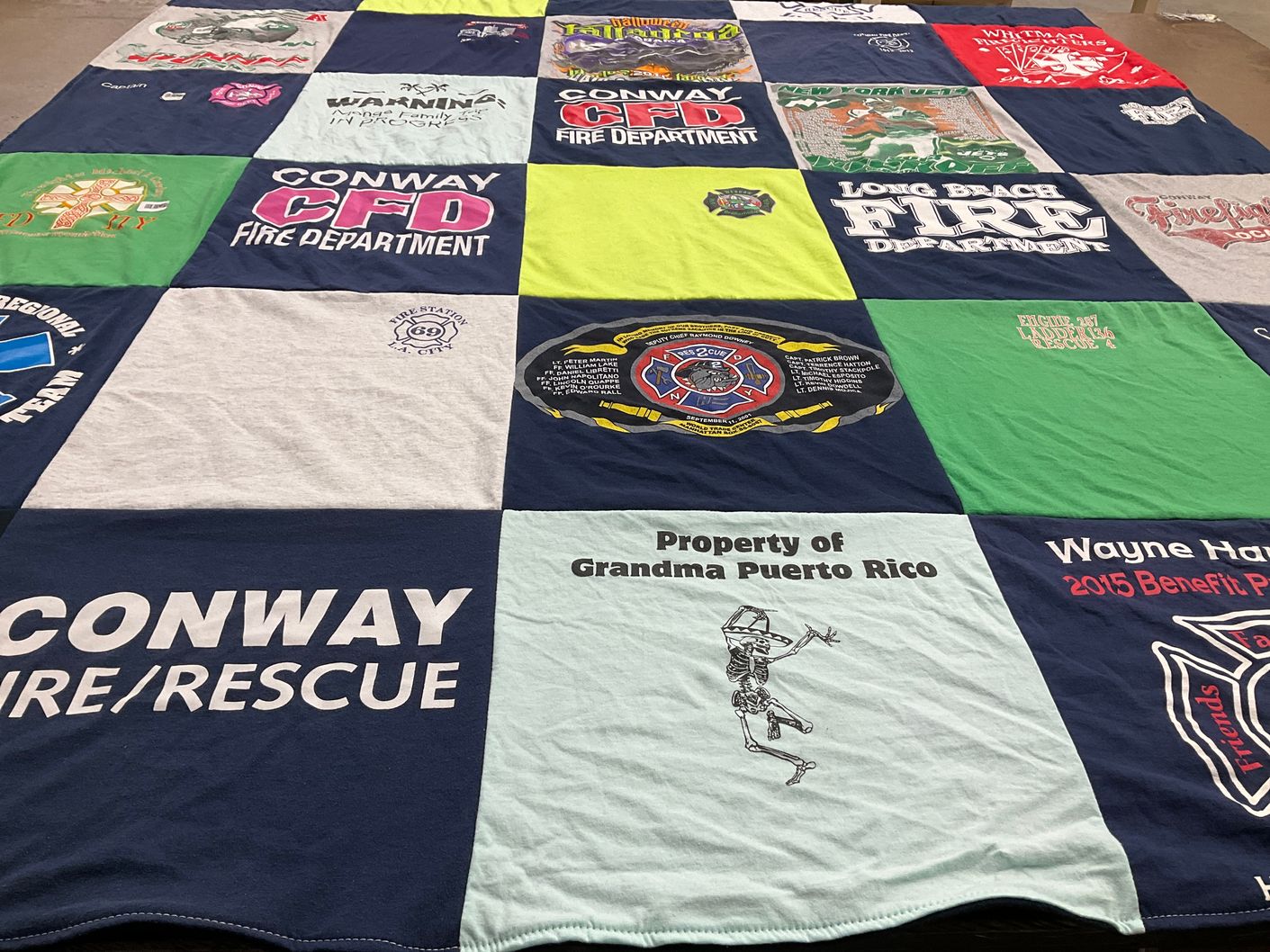 T-shirt quilt with firefighting, community service themes by Rick from AR