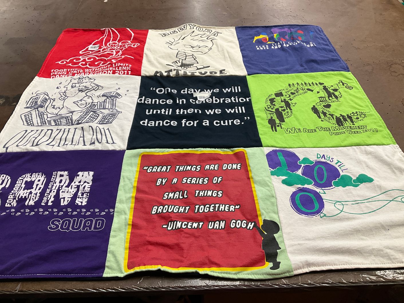 T-shirt quilt with community, dance themes by Laurie from NY