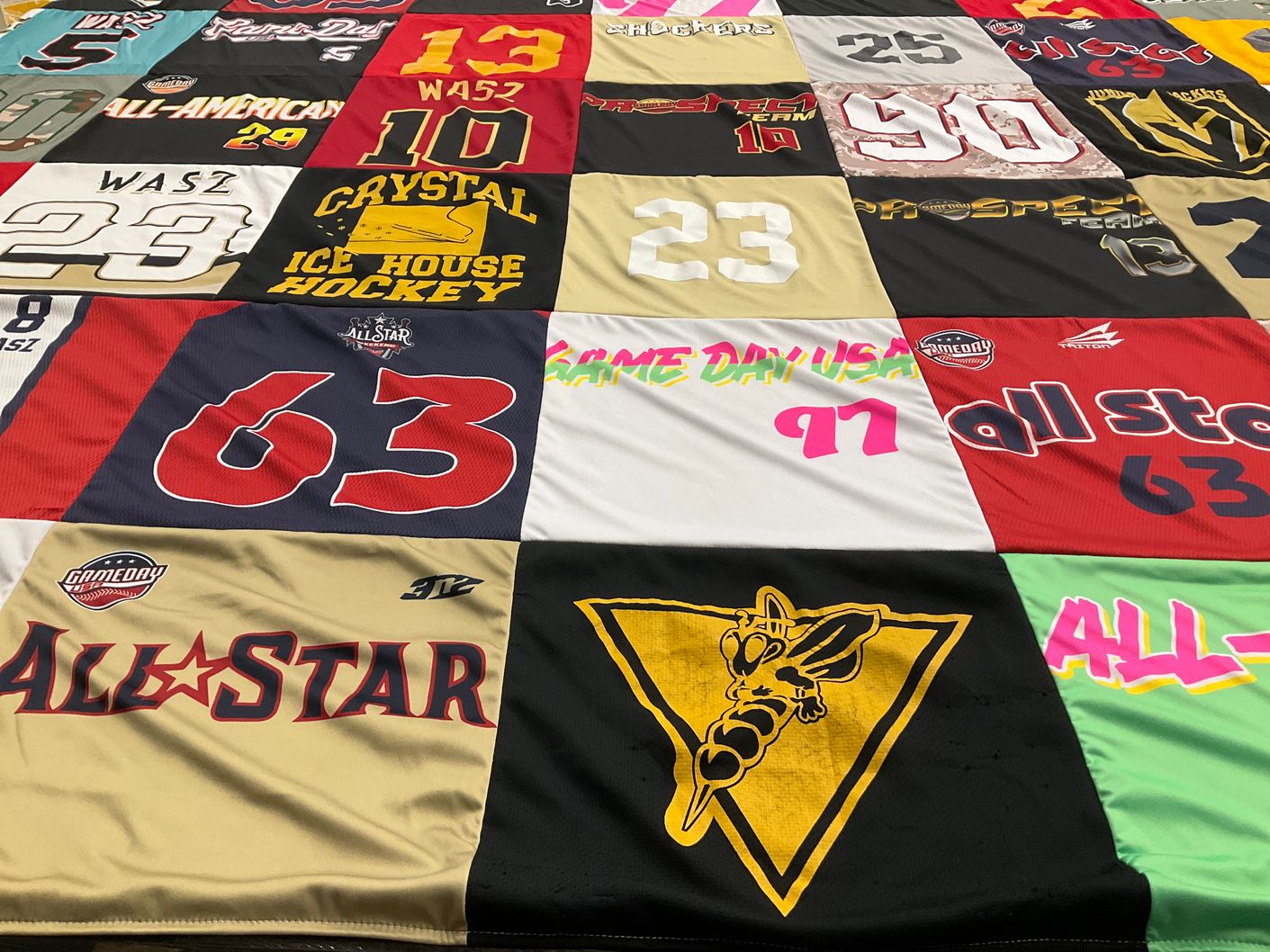 T-shirt quilt with hockey, sports themes by Melissa from IL