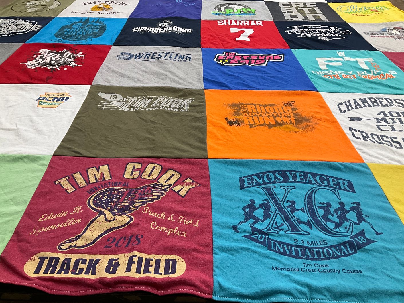 T-shirt quilt featuring tim cook track and field invitational, enostyeager cross country invitational by Sara from PA