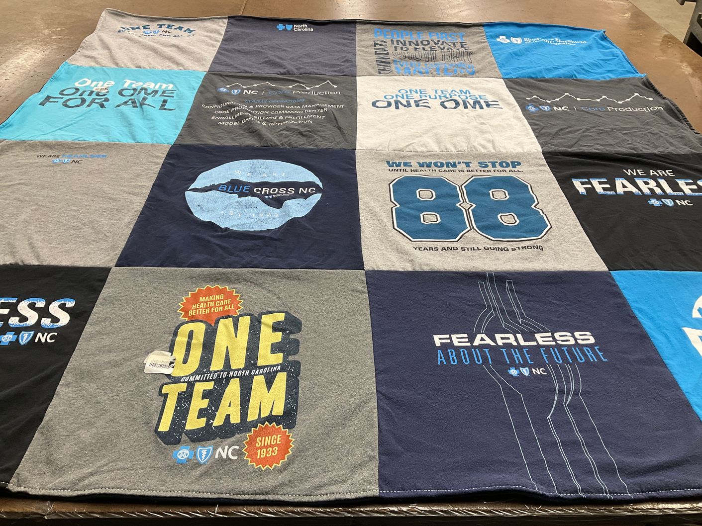 T-shirt quilt with health care, community support themes by James from NC