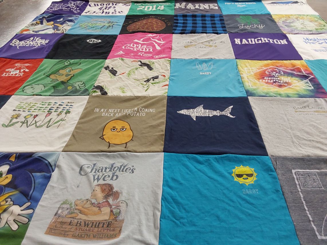 T-shirt quilt with camping, literature themes by Jaime from ME