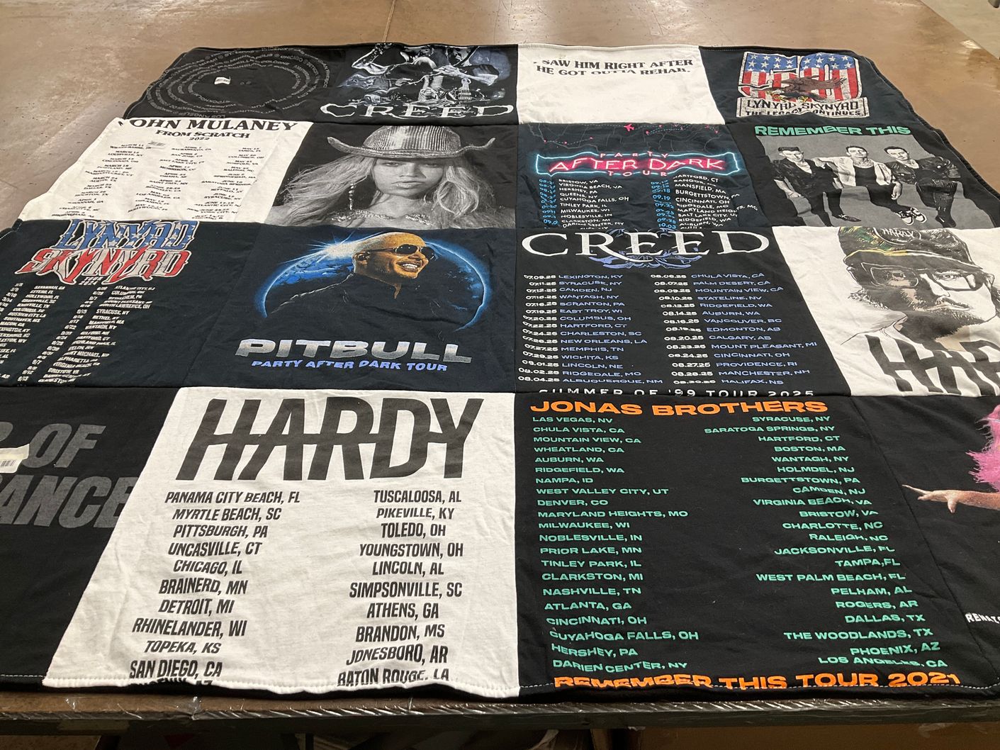 T-shirt quilt with comedy, music themes by Megan from CT