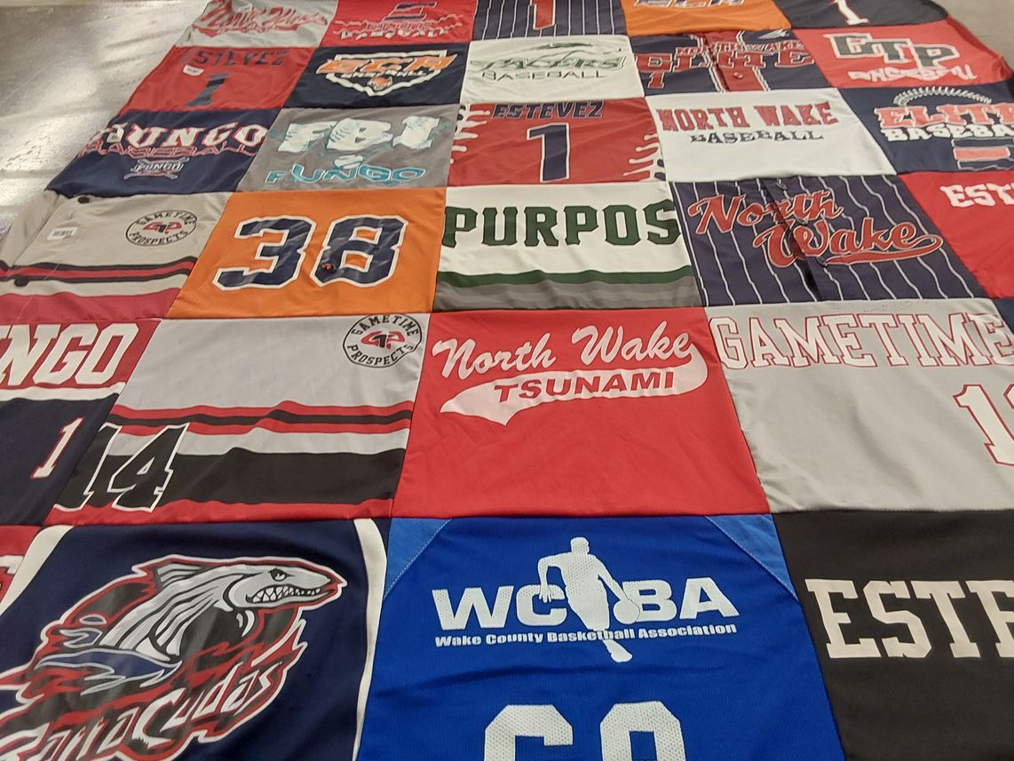 T-shirt quilt featuring north wake tsunamis by Rosanna from NC