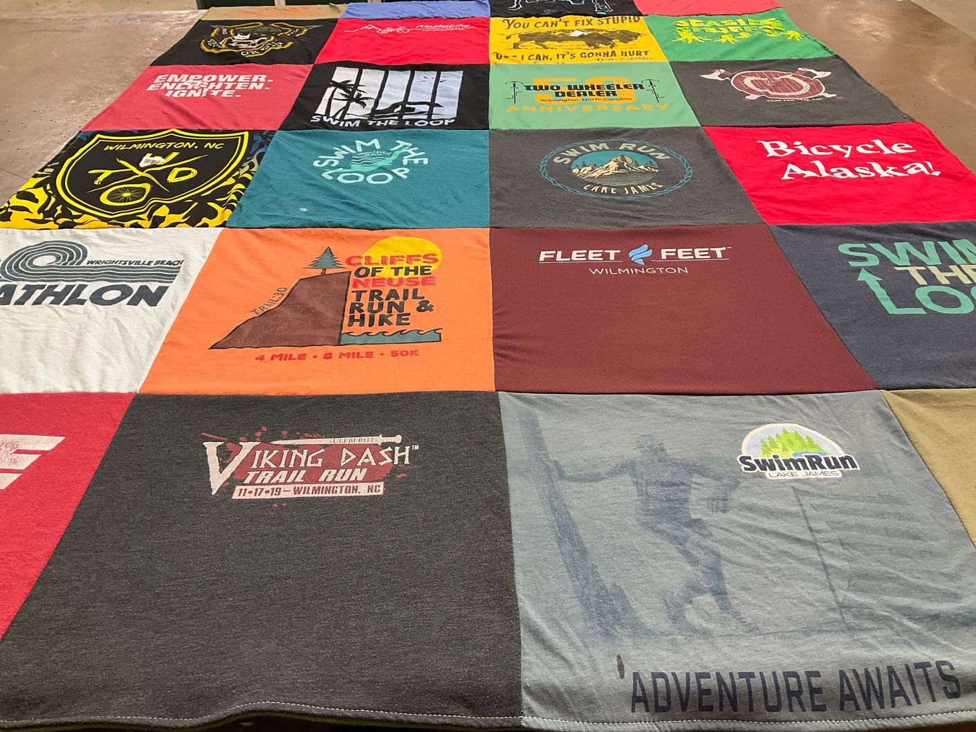 T-shirt quilt with running, swimming themes by Vic from NC