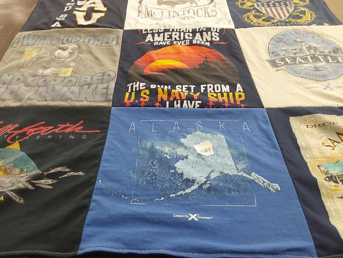 T-shirt quilt with fishing, travel themes by Dana from CA