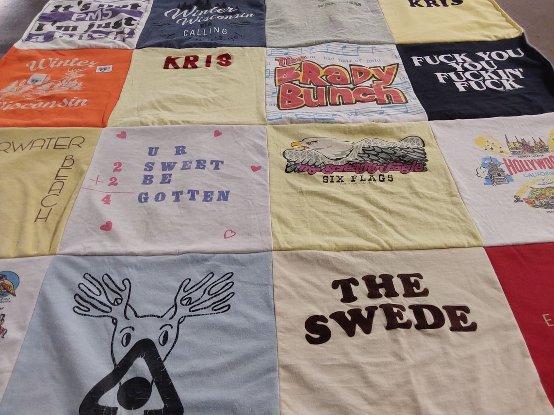 T-shirt quilt with winter activities, amusement parks themes by Krissy from CA