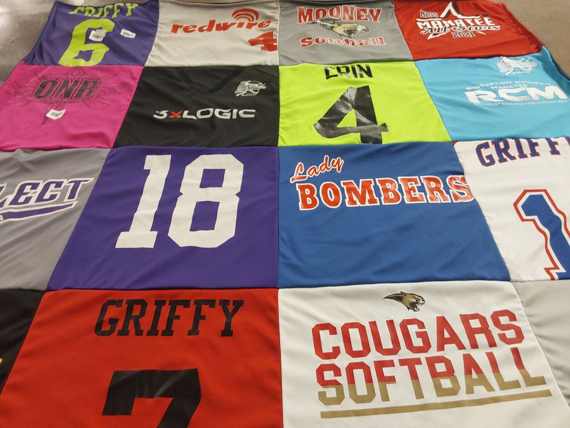 T-shirt quilt featuring lady bombers, cougars softball by Kelly from FL