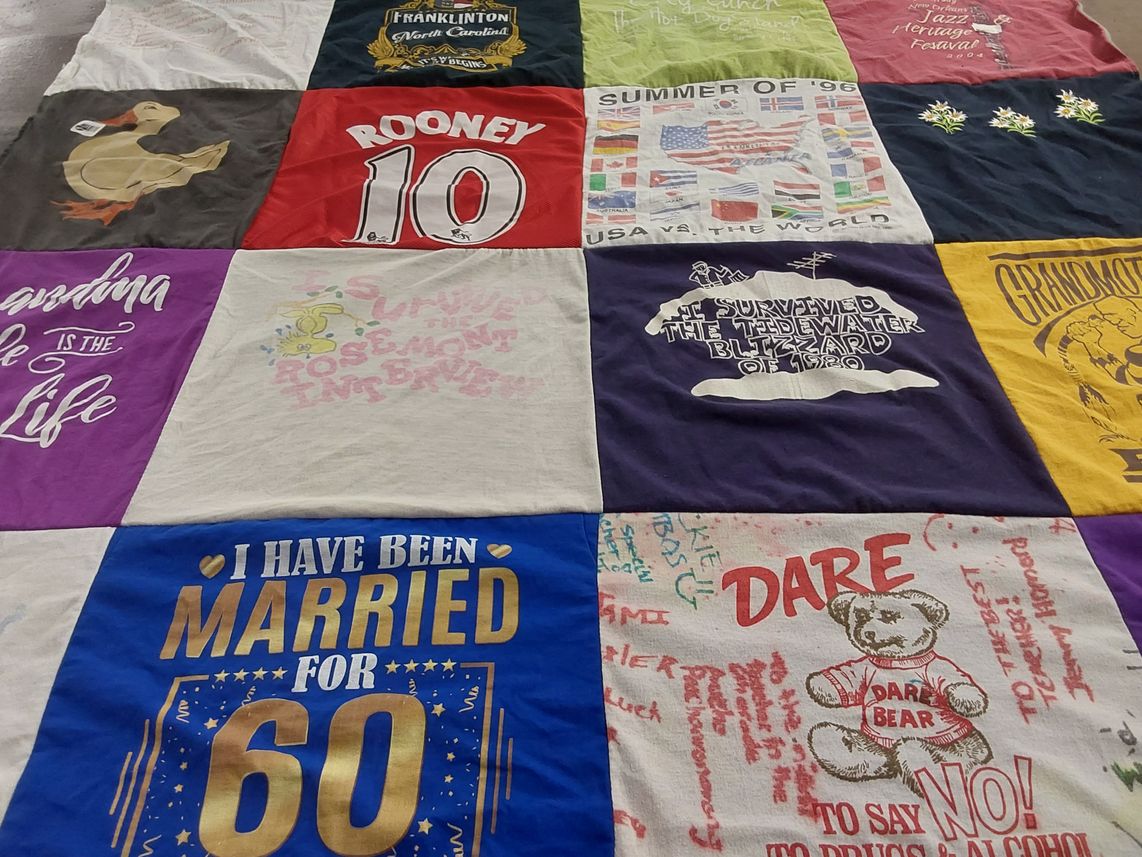 T-shirt quilt with history, festivals themes by Joanne from NC