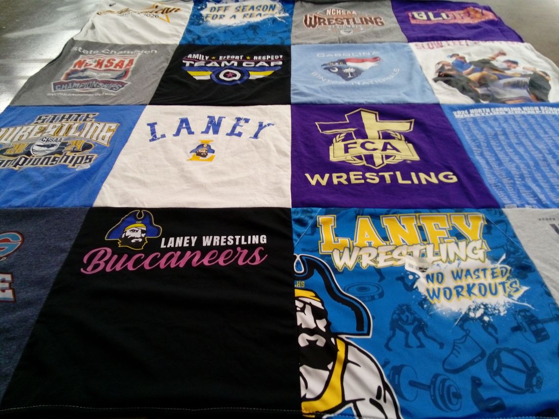 T-shirt quilt featuring laney wrestling by Betty from NC