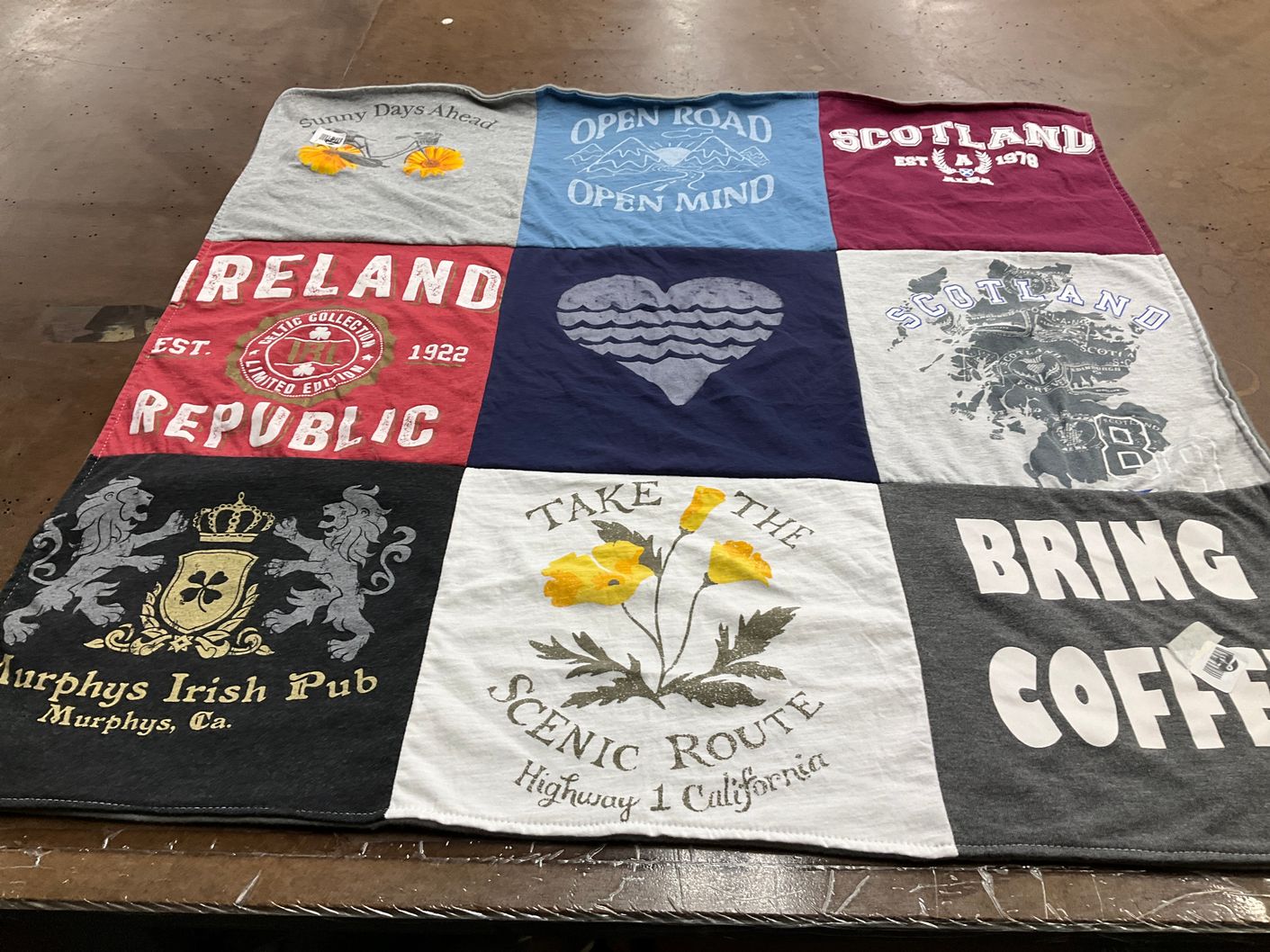 T-shirt quilt with travel, food themes by Laura from CA