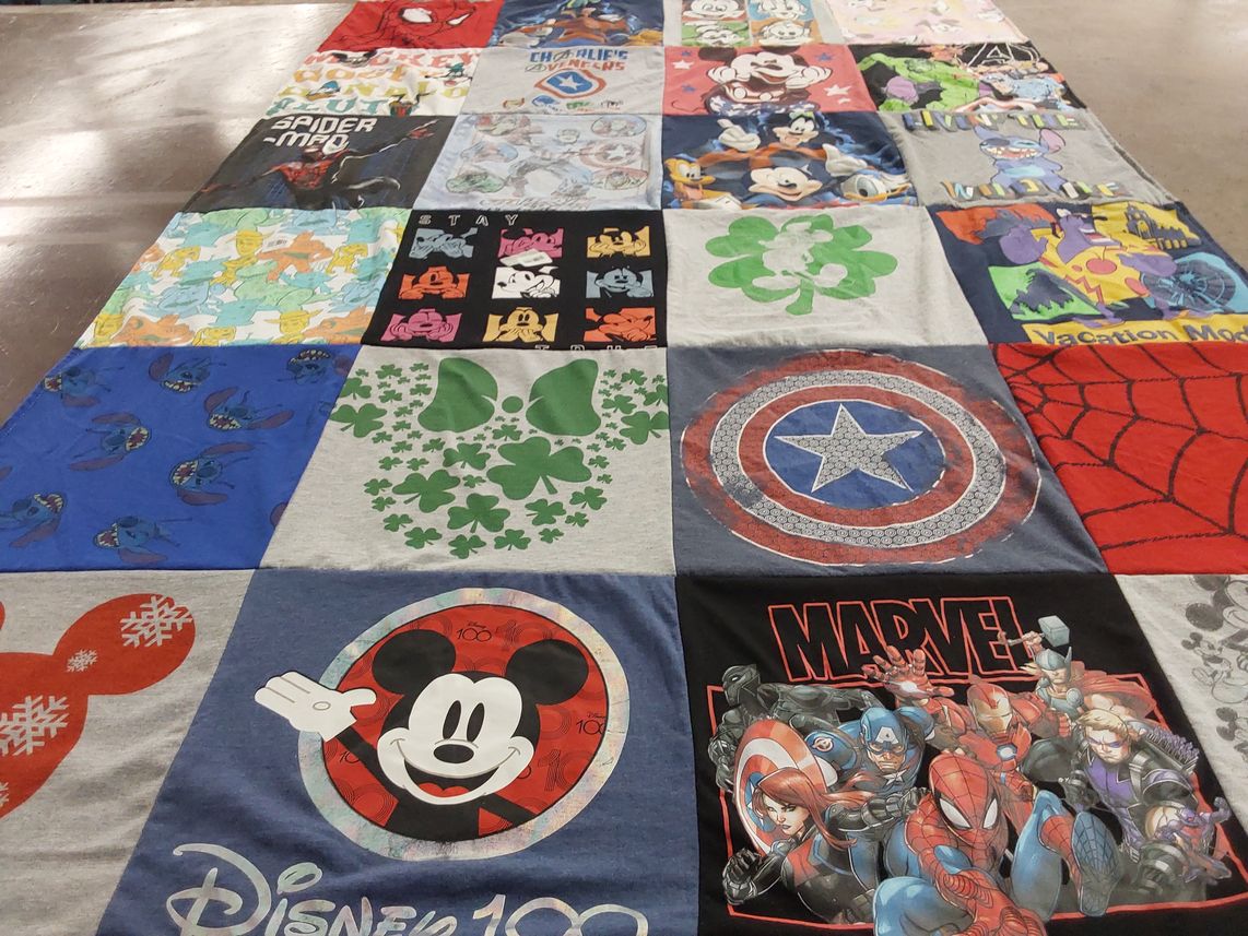 T-shirt quilt with disney, marvel themes by Paula from TX