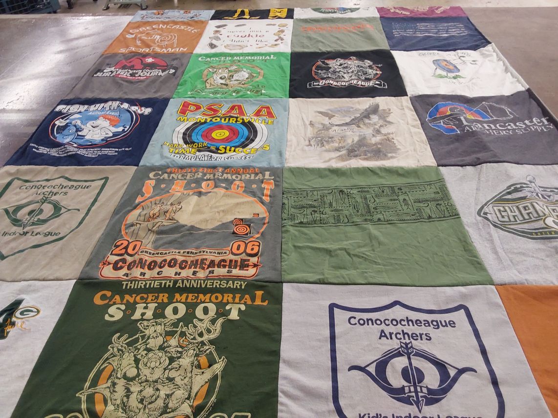 T-shirt quilt with archery, fishing themes by Cindy from PA