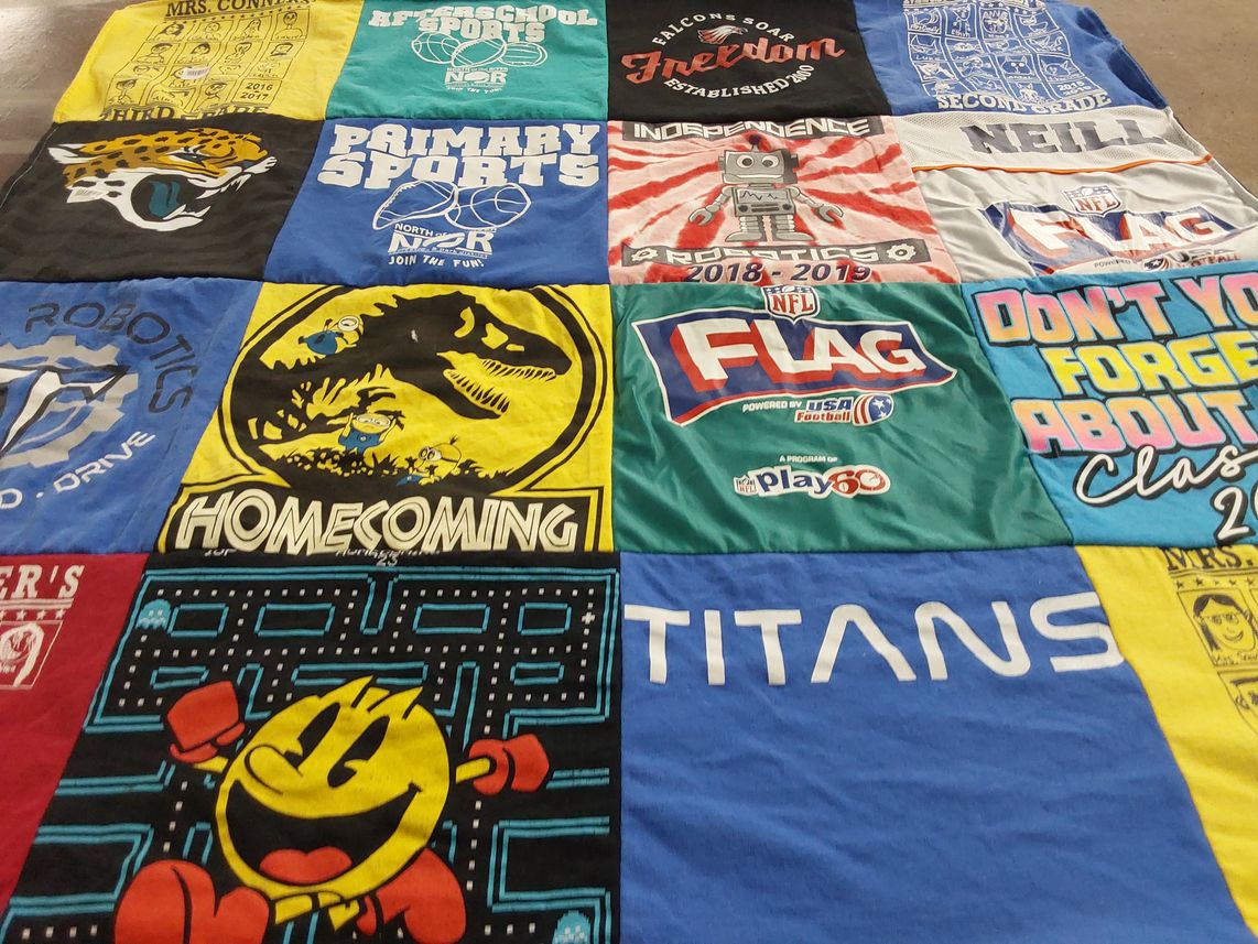 T-shirt quilt with sports, robotics themes by Candice from CA