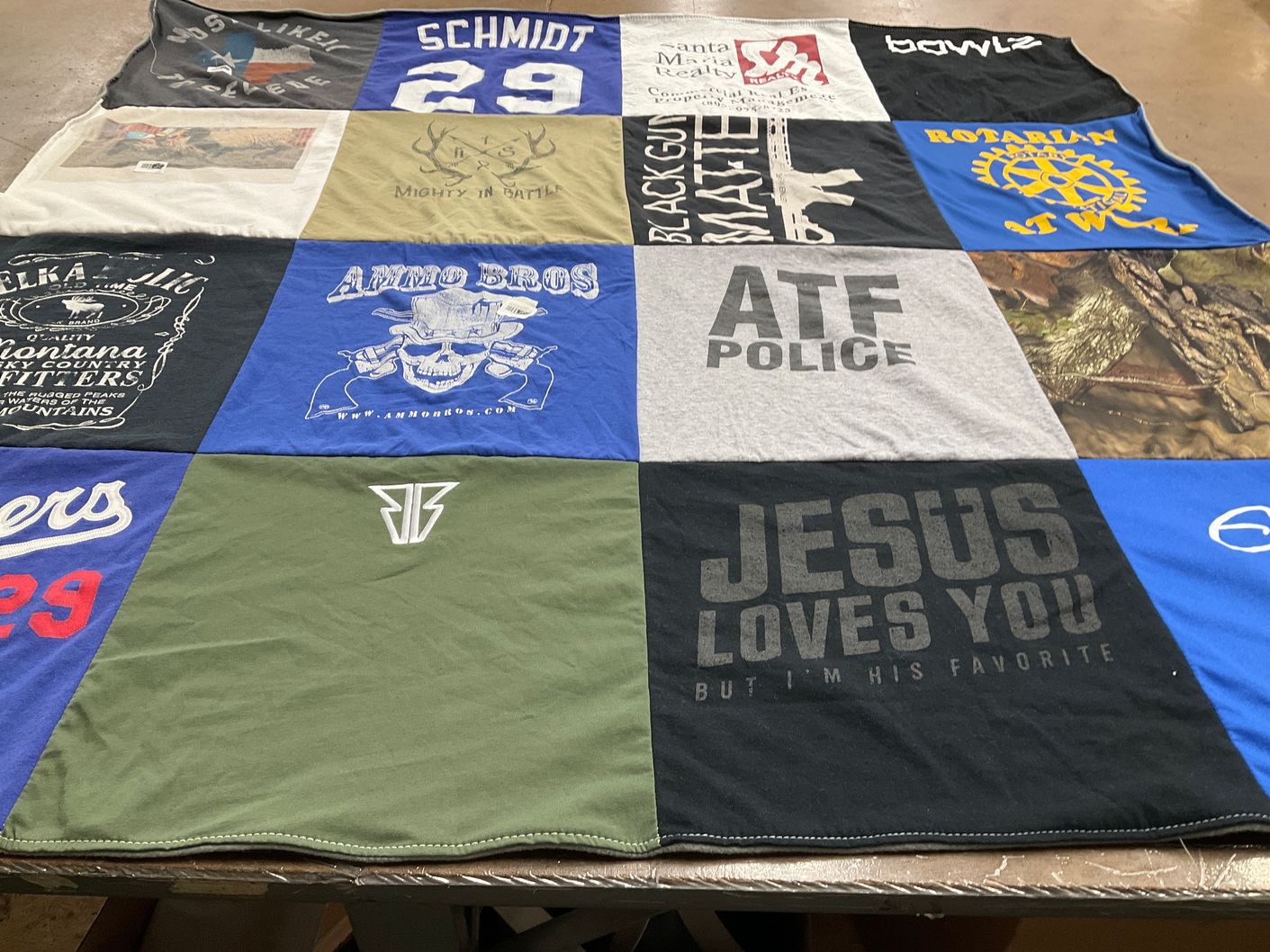 T-shirt quilt with hunting, firearms themes by Sara from CA