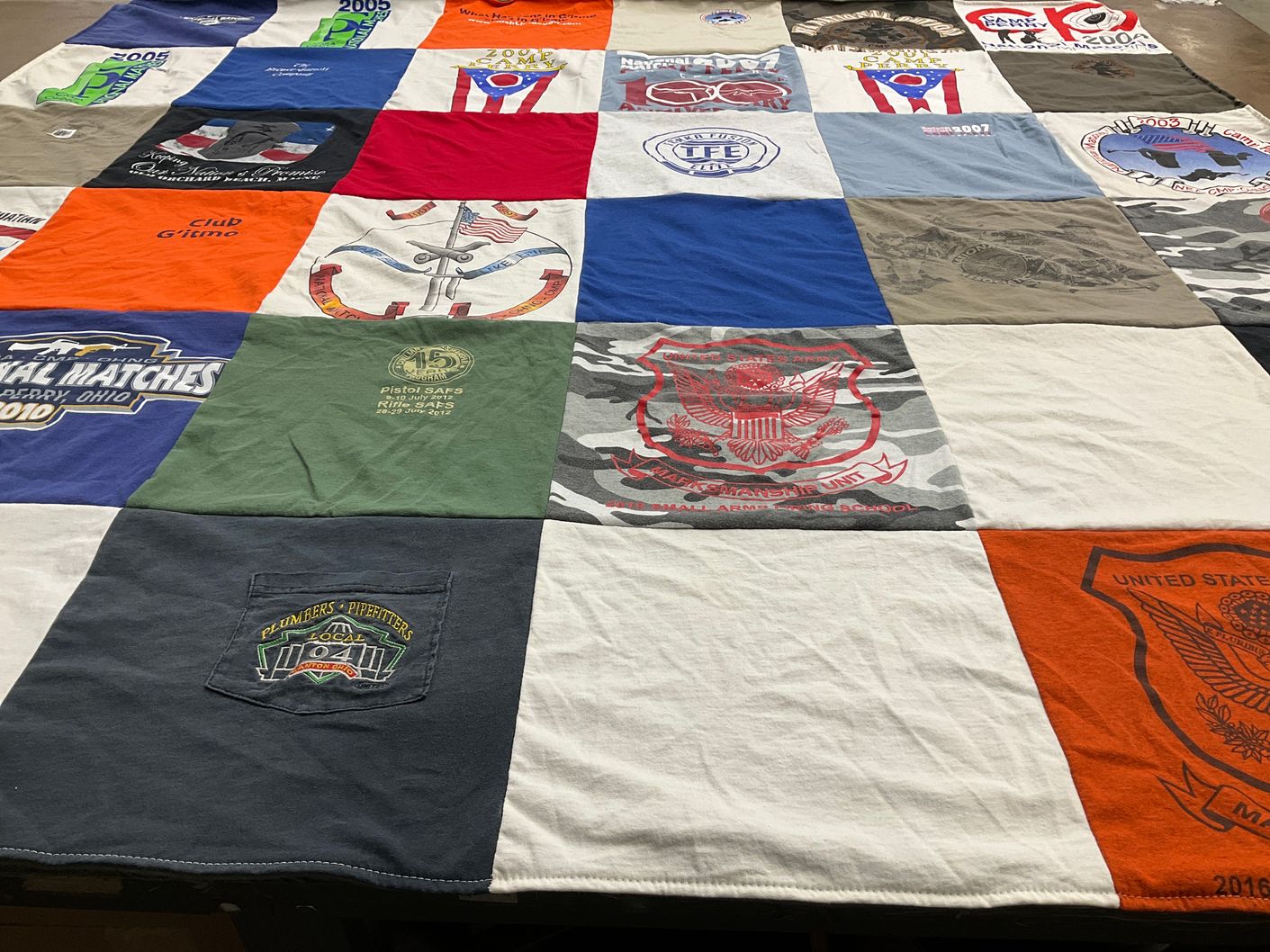 T-shirt quilt with shooting, hunting themes by 3507 Becky circle nw from OH