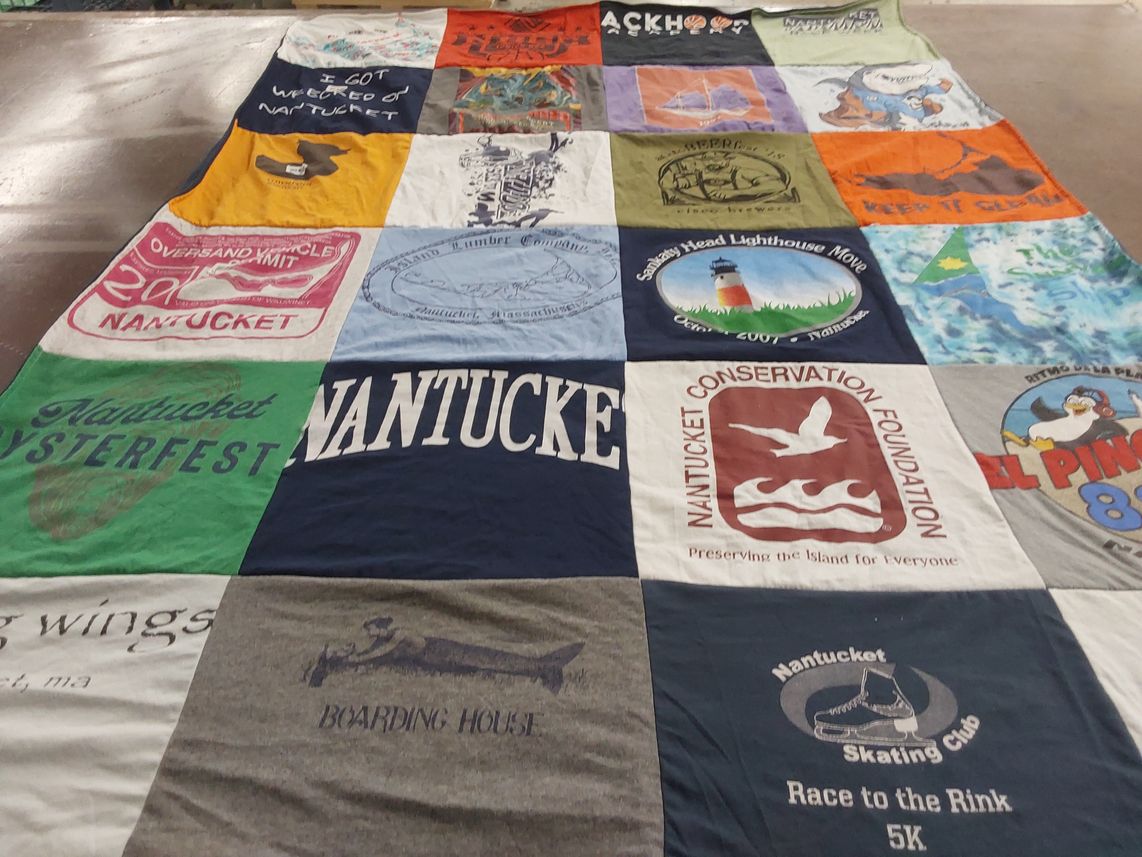 T-shirt quilt with community events, conservation themes by Saralyn from NH