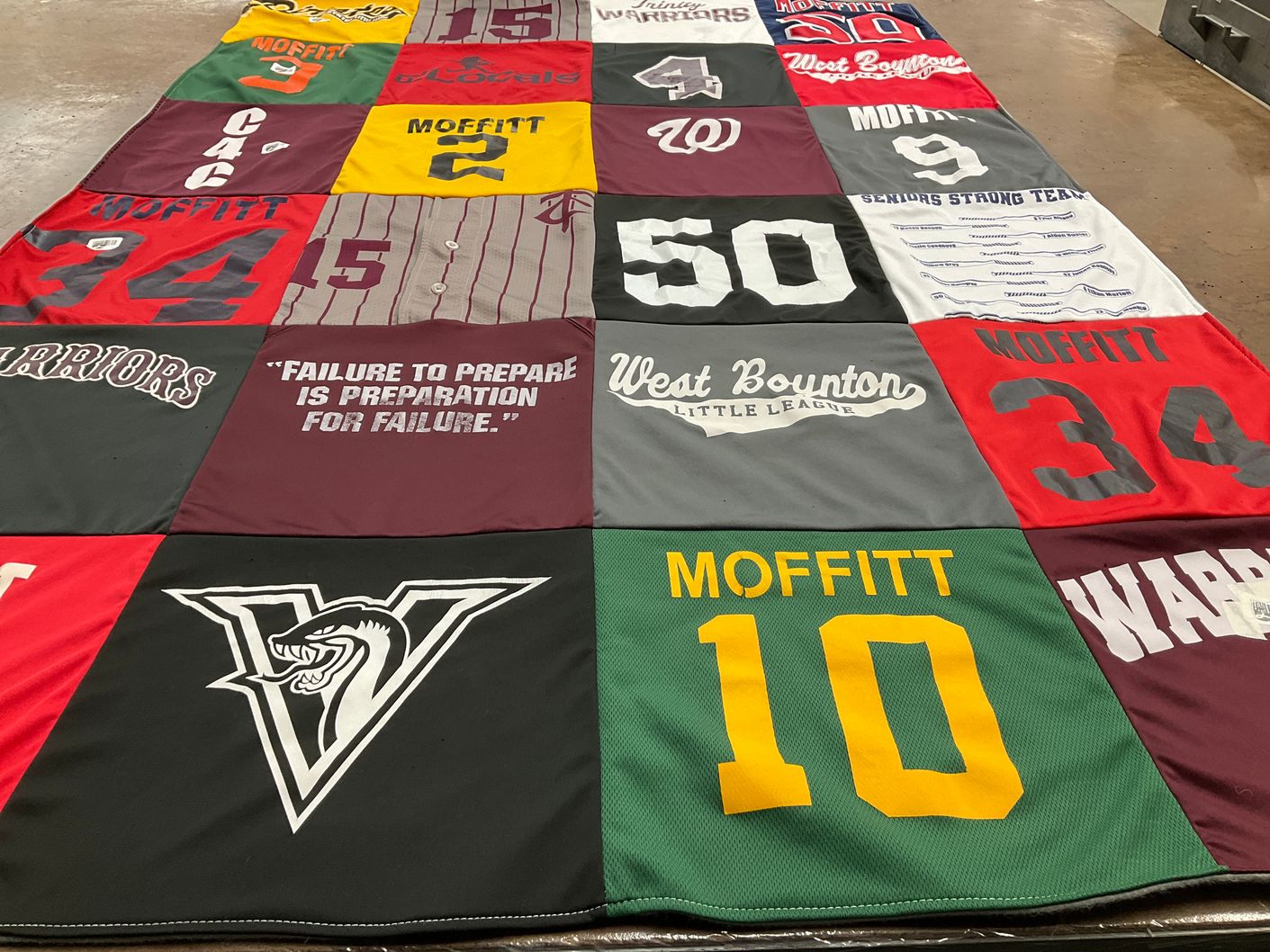 T-shirt quilt with sports, teamwork themes by Julie from FL