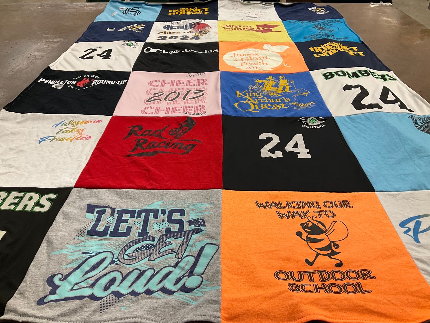 T-shirt quilt with cheerleading, volleyball themes by Clifford from OR