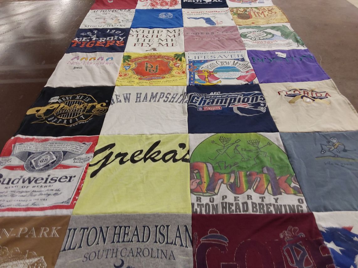 T-shirt quilt with sports, travel themes by Kathleen from NH