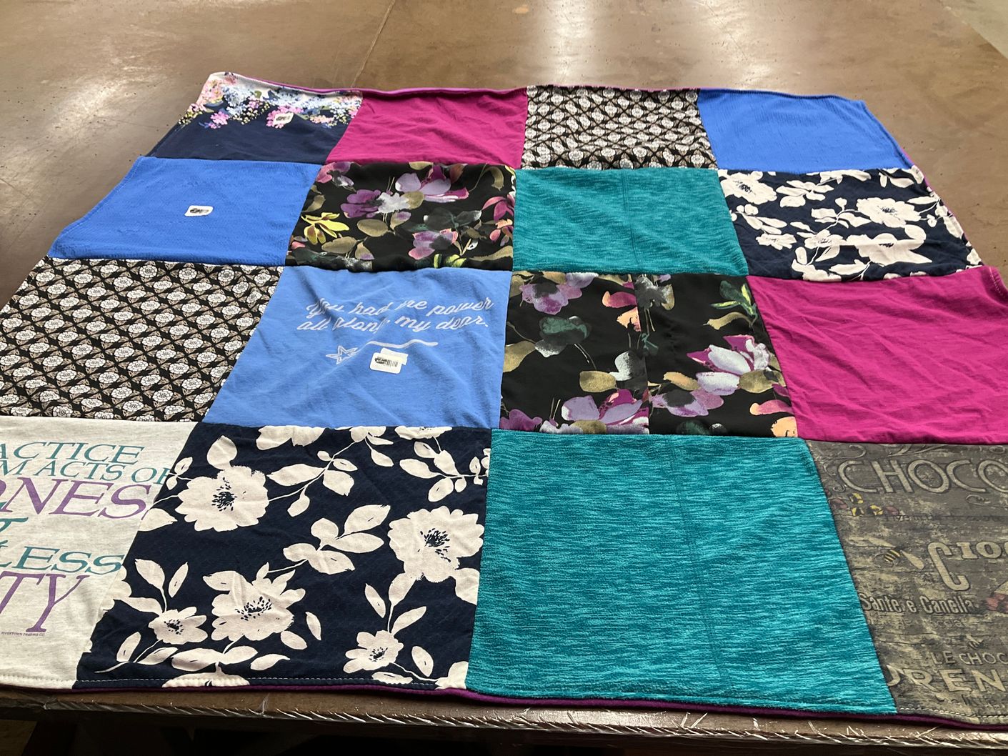 T-shirt quilt with inspiration, wellness themes by Nancy from MA