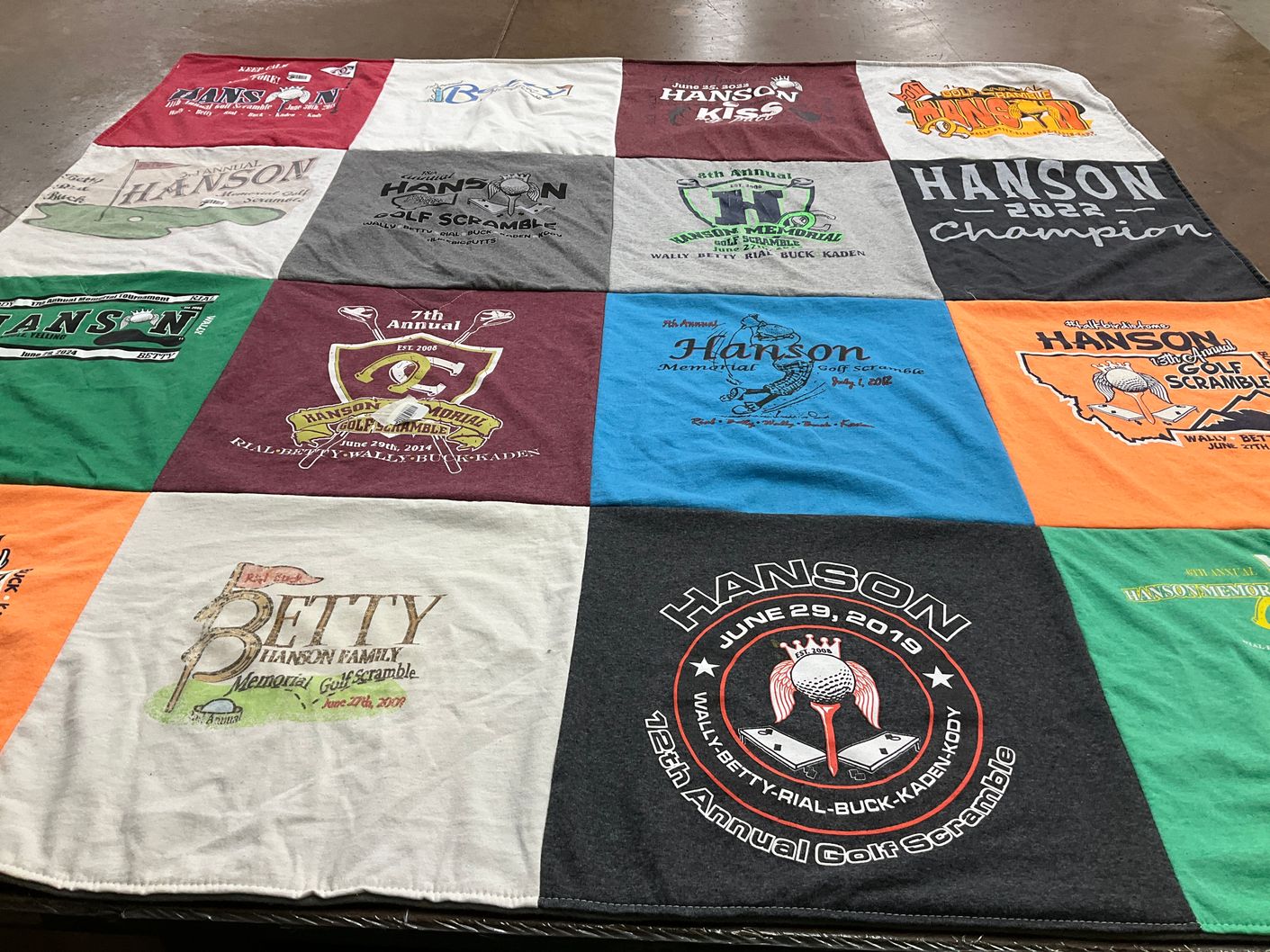 T-shirt quilt with golf, family events themes by Charlene from AZ