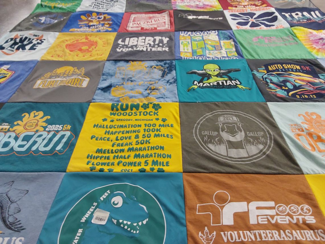 T-shirt quilt with running, marathons themes by Sara Lynne from MI