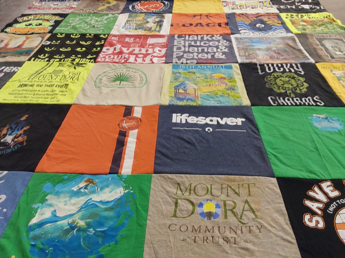 T-shirt quilt with community service, environment themes by Pamela from FL