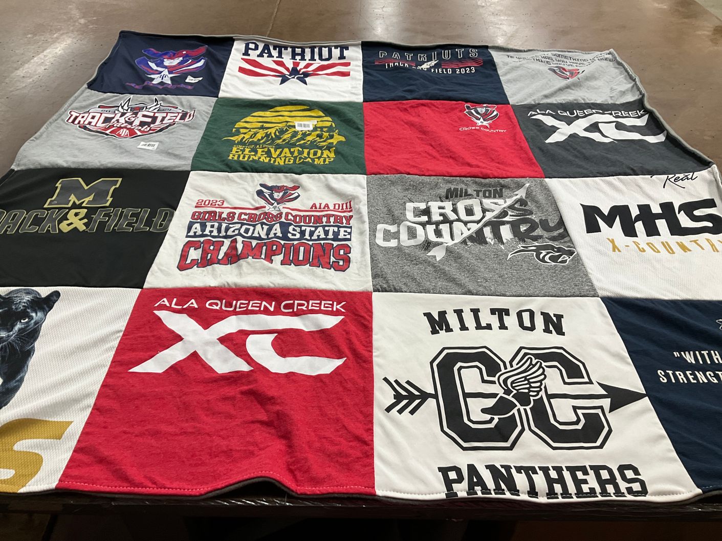 T-shirt quilt featuring milton cross country team, patriots track and field team by Emily from FL