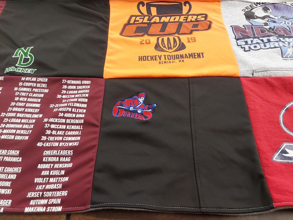T-shirt quilt featuring turtle river high school hockey team by Amanda from ND