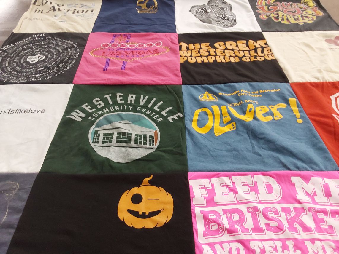 T-shirt quilt with theater, community events themes by Catherine from OH