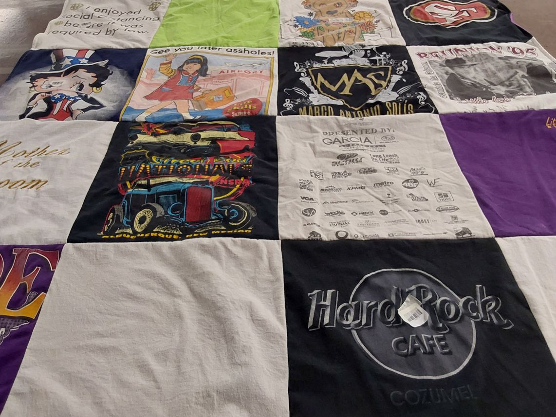 T-shirt quilt with dancing, travel themes by Nancy from NM