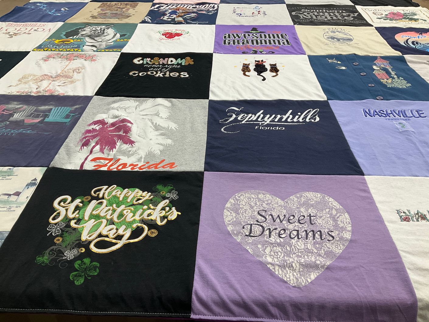 T-shirt quilt with travel, family themes by Sandra from MA