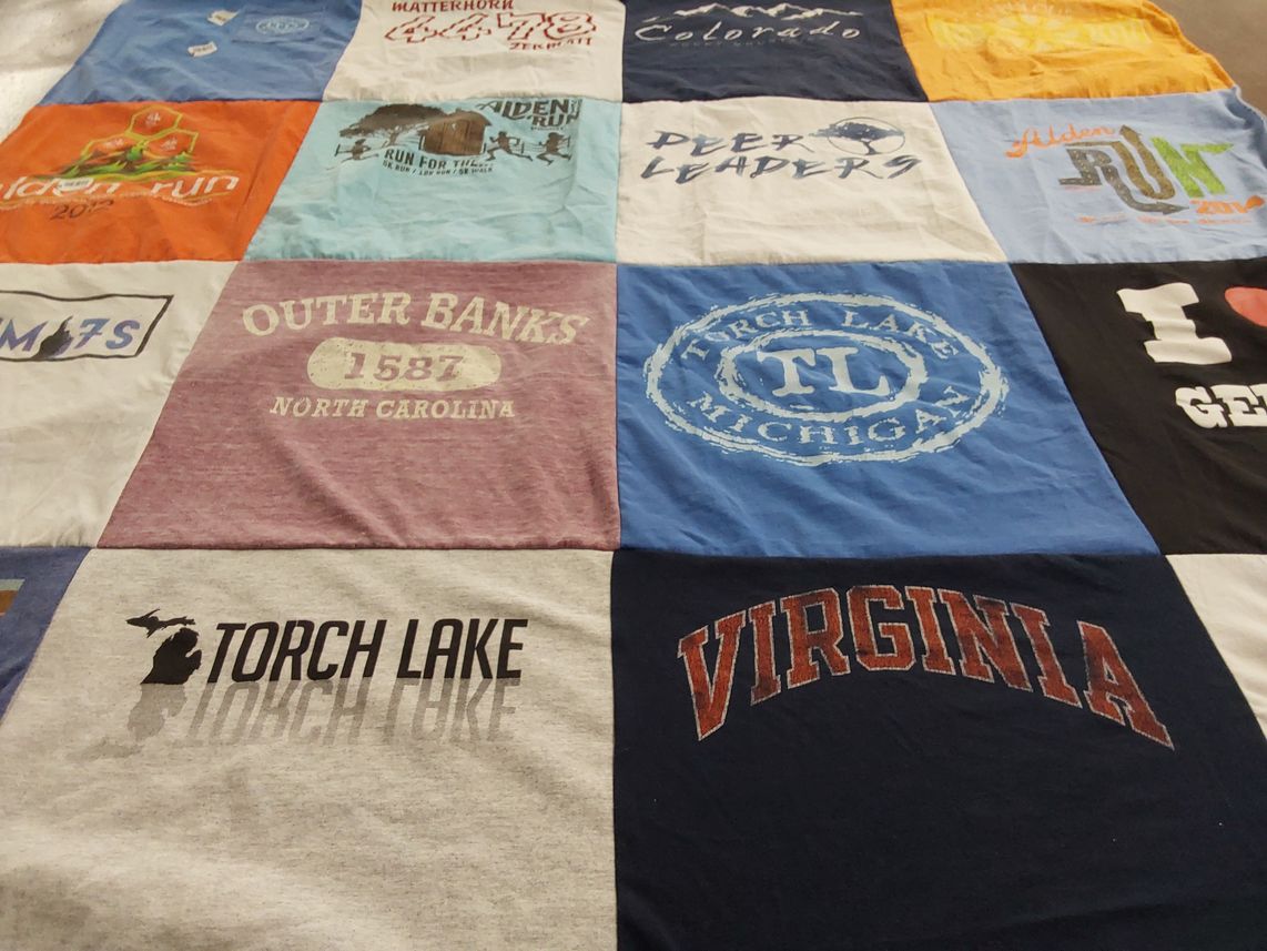 T-shirt quilt with running, traveling themes by Emma from CA