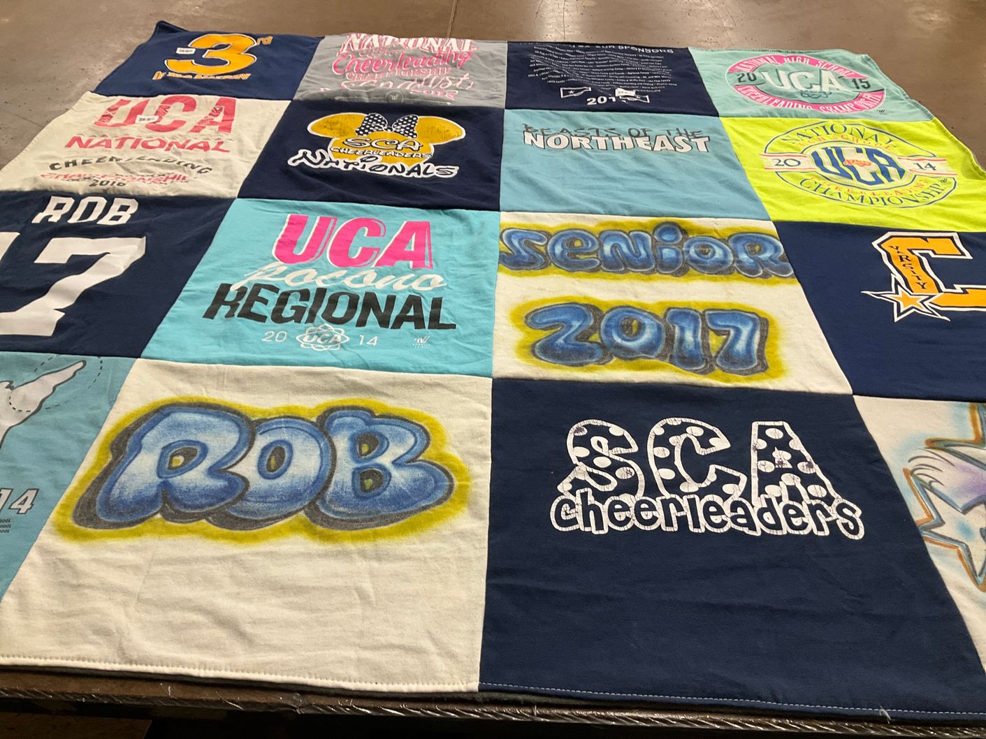 T-shirt quilt with cheerleading themes by Robynn from NY