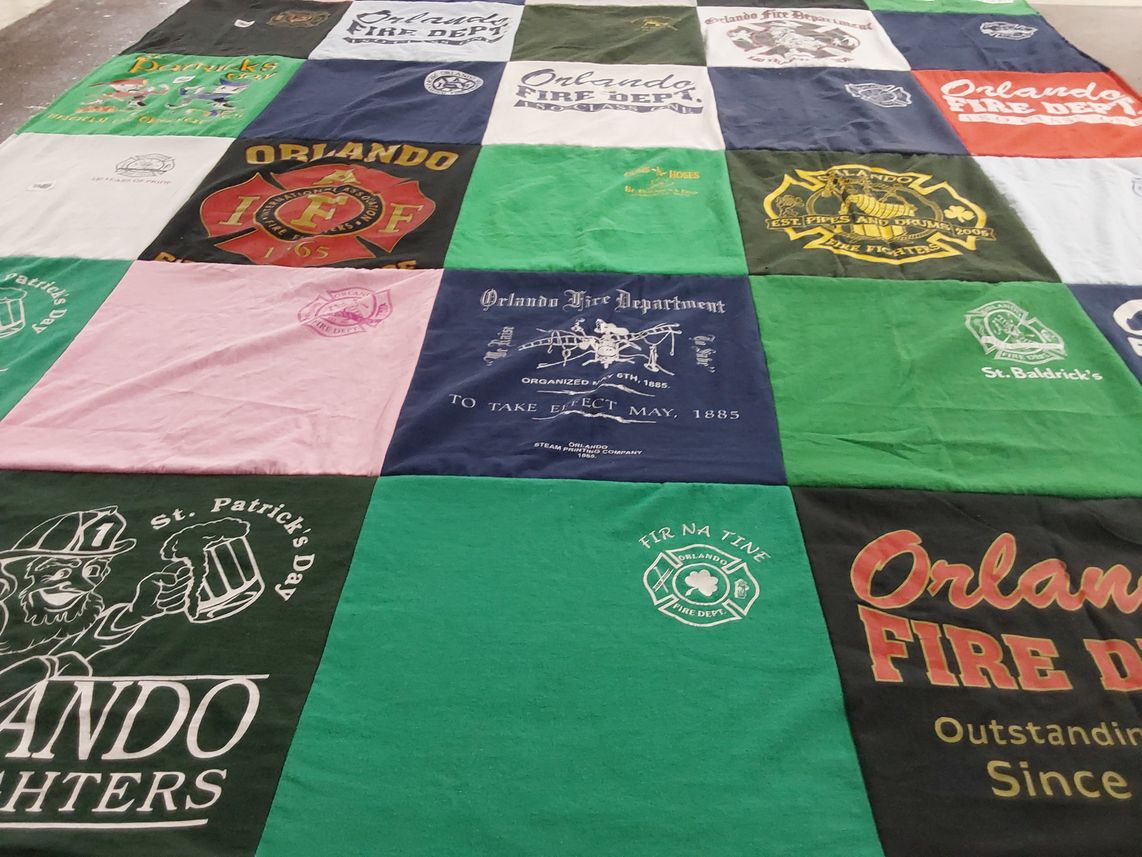 T-shirt quilt with firefighting, community service themes by Ken from FL