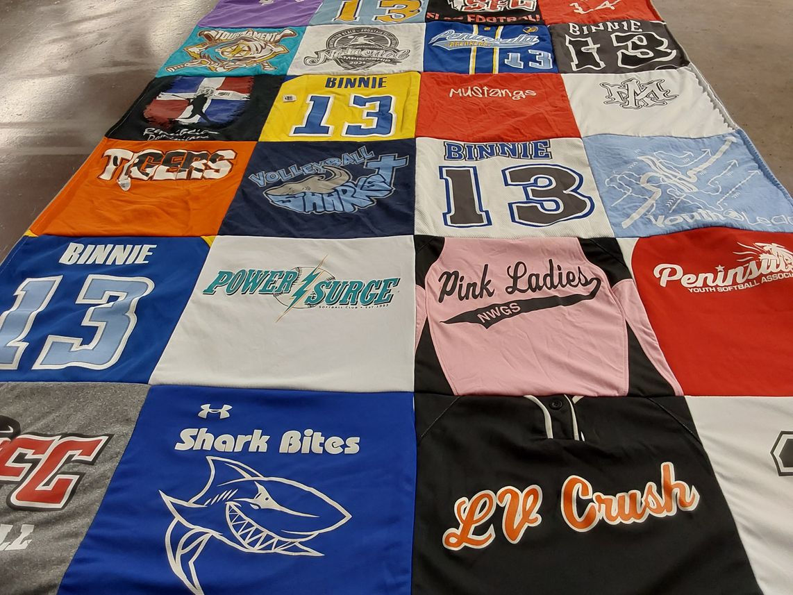 T-shirt quilt with softball, volleyball themes by Meredith from CA
