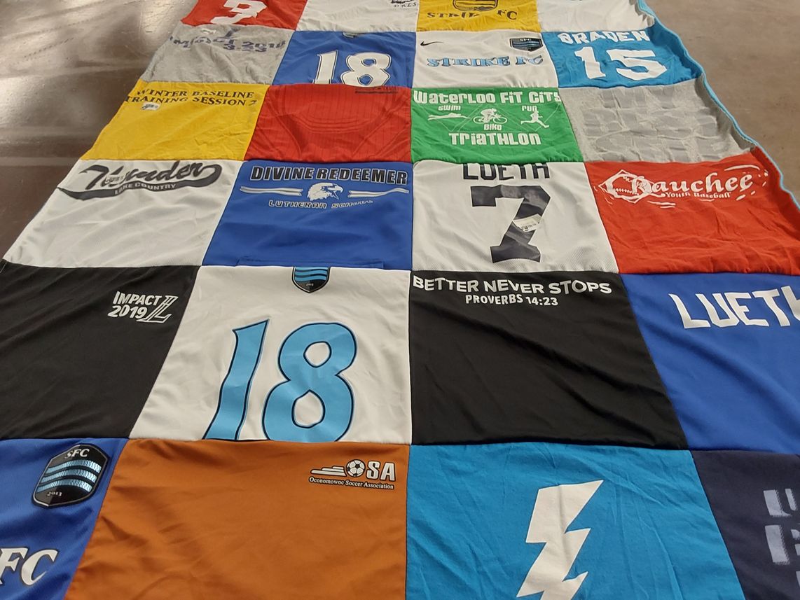 T-shirt quilt with soccer, sports themes by Ann from KS