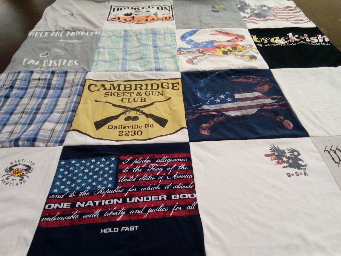 T-shirt quilt with hunting, fishing themes by Jan from MD