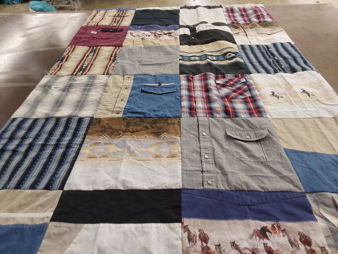 T-shirt quilt with quilting themes by Jacqueline from TX