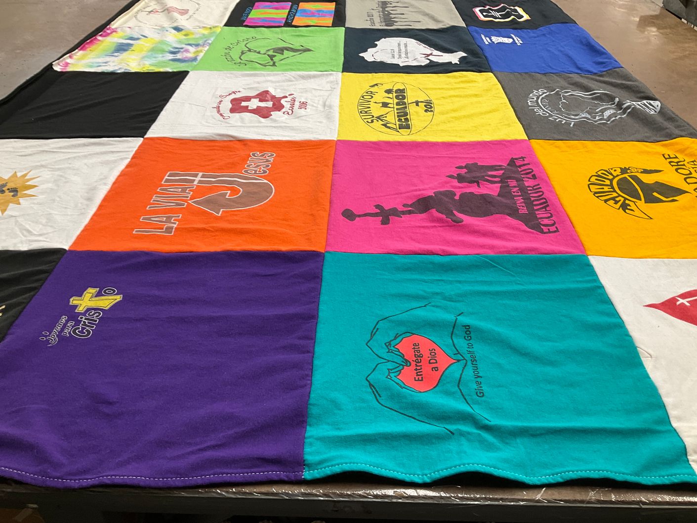 T-shirt quilt with religion, community themes by DeAnna from FL