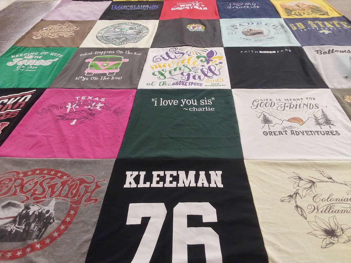 T-shirt quilt with travel, family themes by Deb from IA